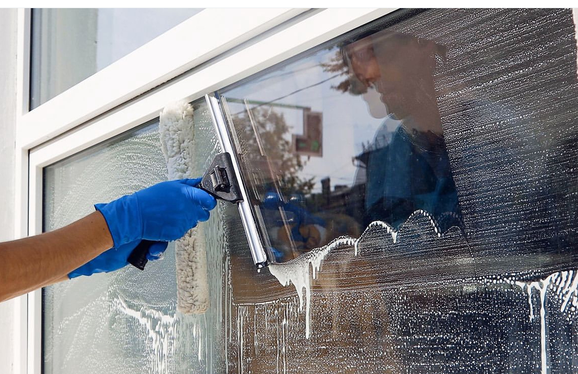 Professional window cleaning in progress